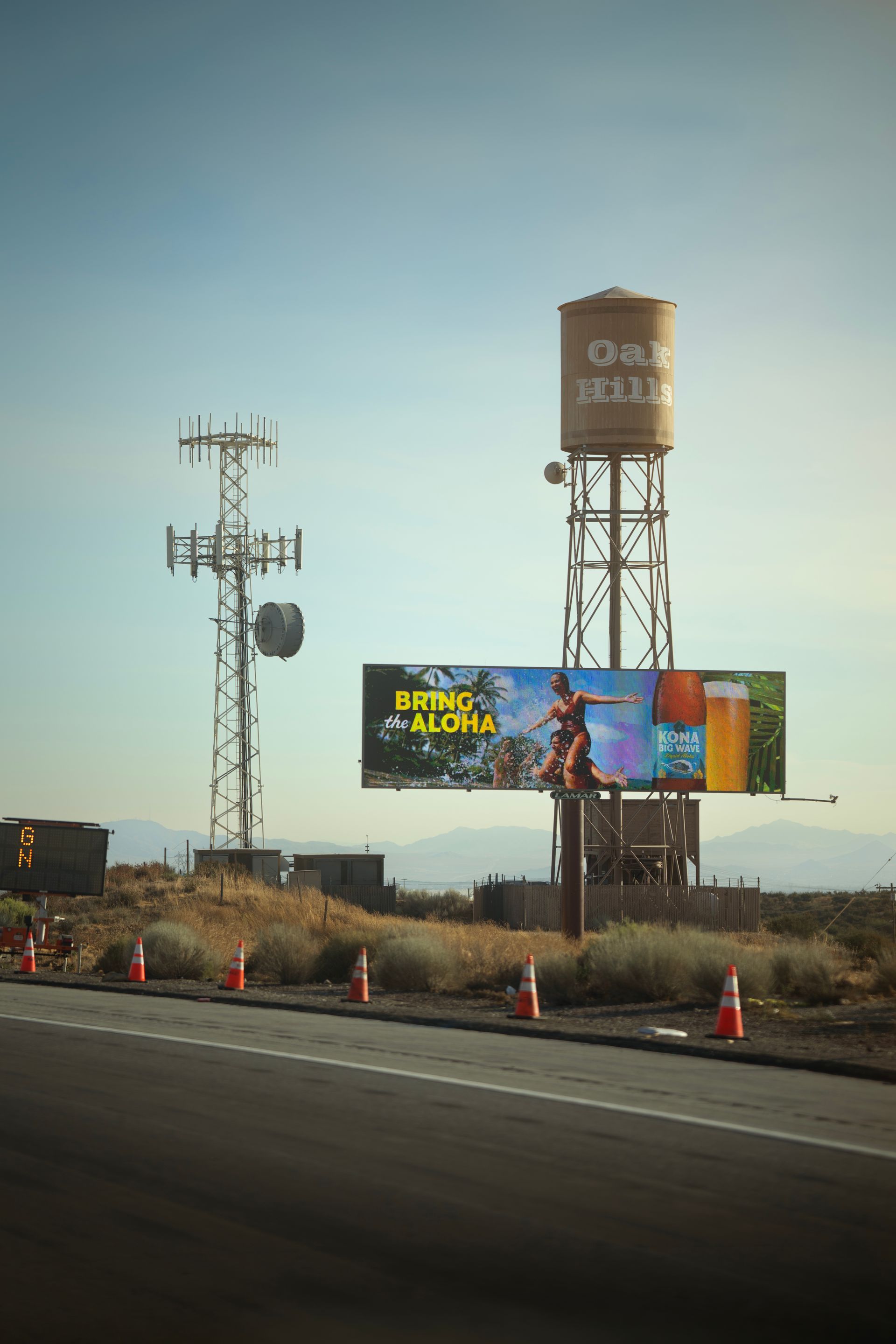 Roadside advertising billboard beside a highway in the American West